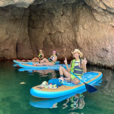 Group paddle boarding at Willow Beach with rentals to Emerald Cave